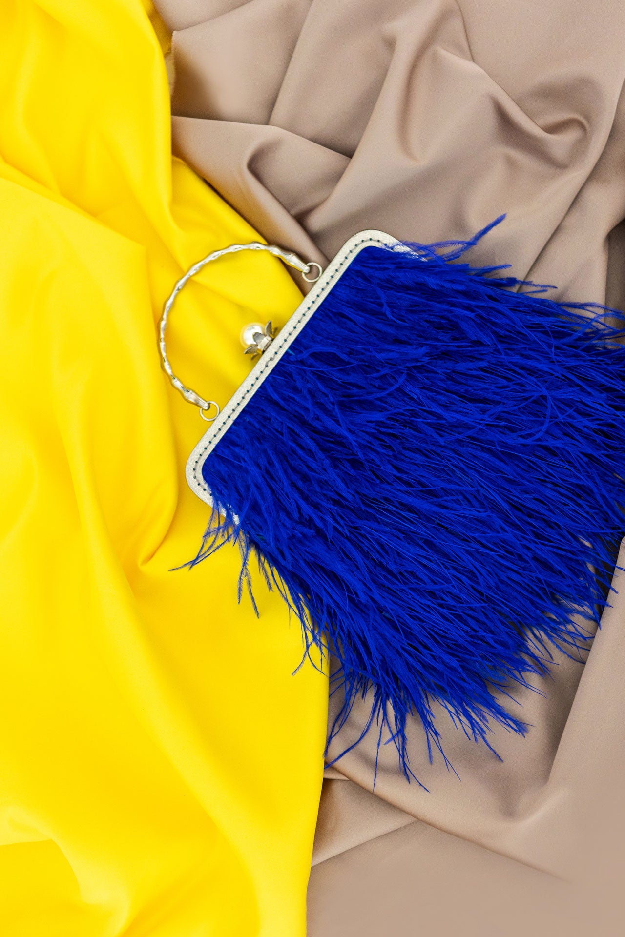 Blue bag with a pearl decorated handle