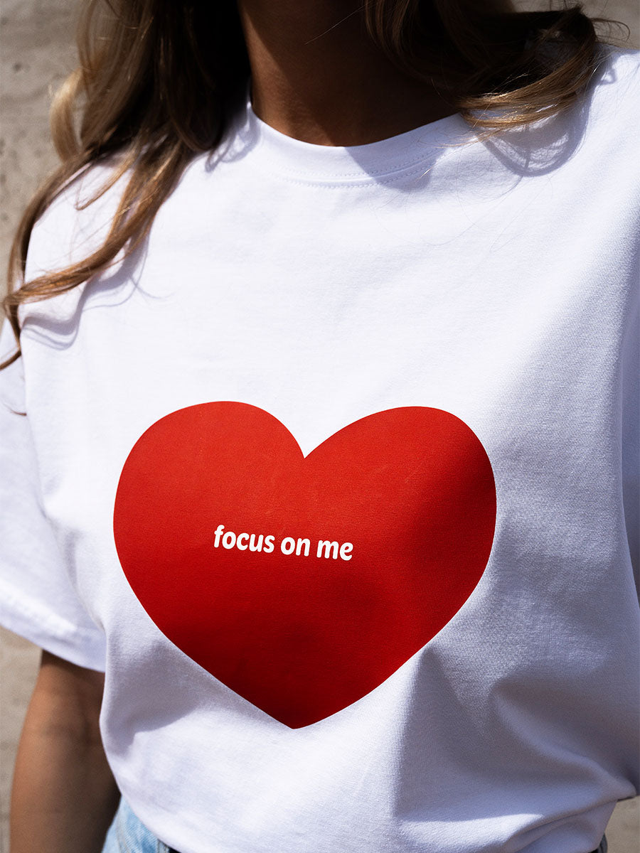White oversize t-shirt with a red heart Focus on me