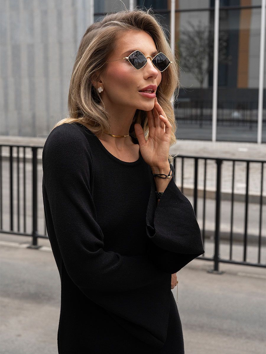 Black knitted midi dress with an open back