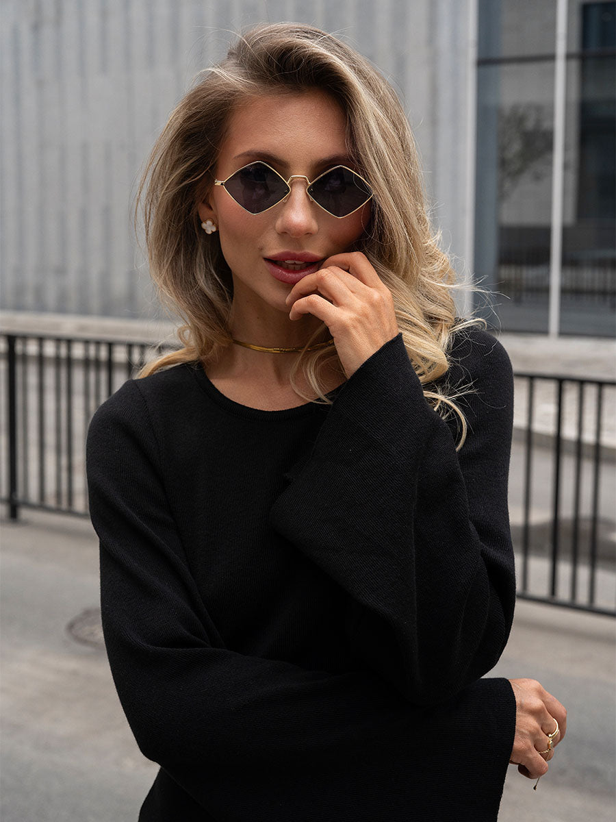Black knitted midi dress with an open back