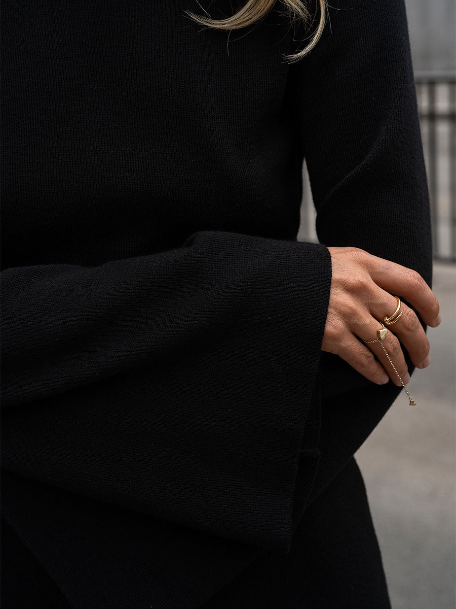 Black knitted midi dress with an open back
