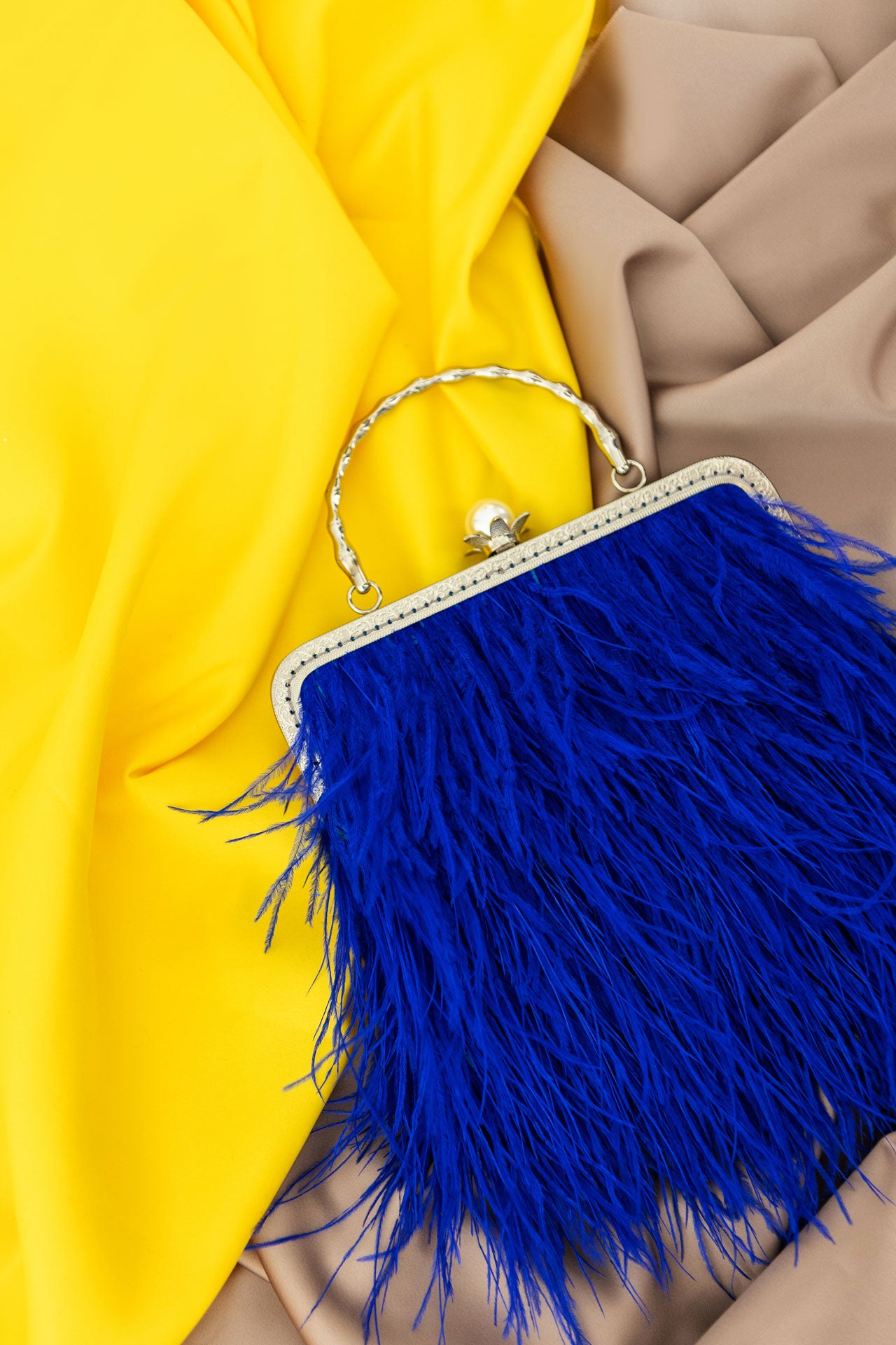 Blue bag with a pearl decorated handle