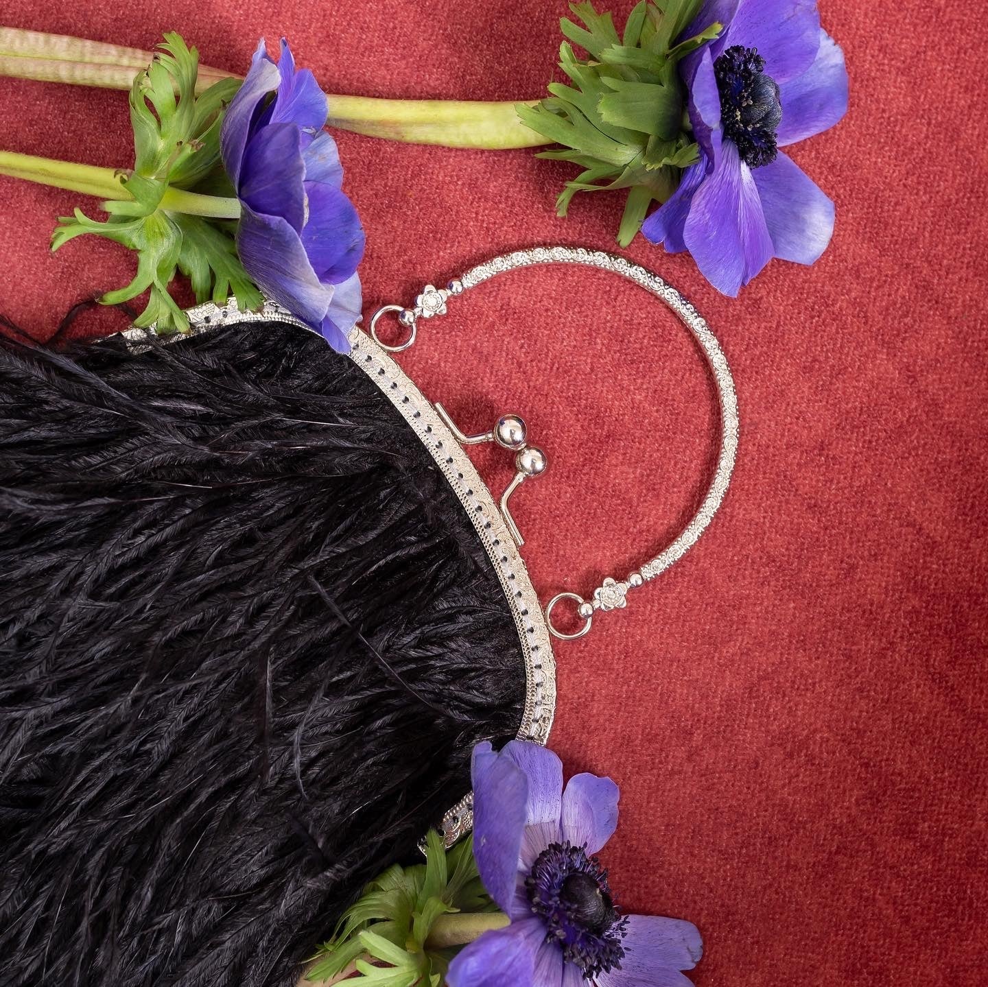 Black bag with a flowers decorated handle