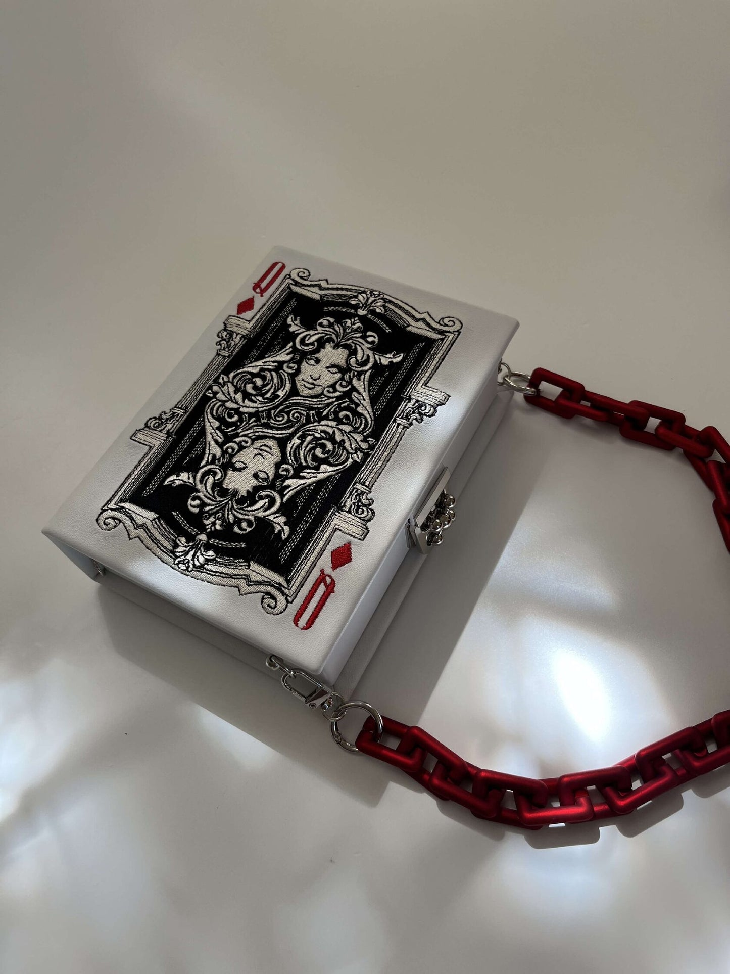 Embroidered clutch Playing card