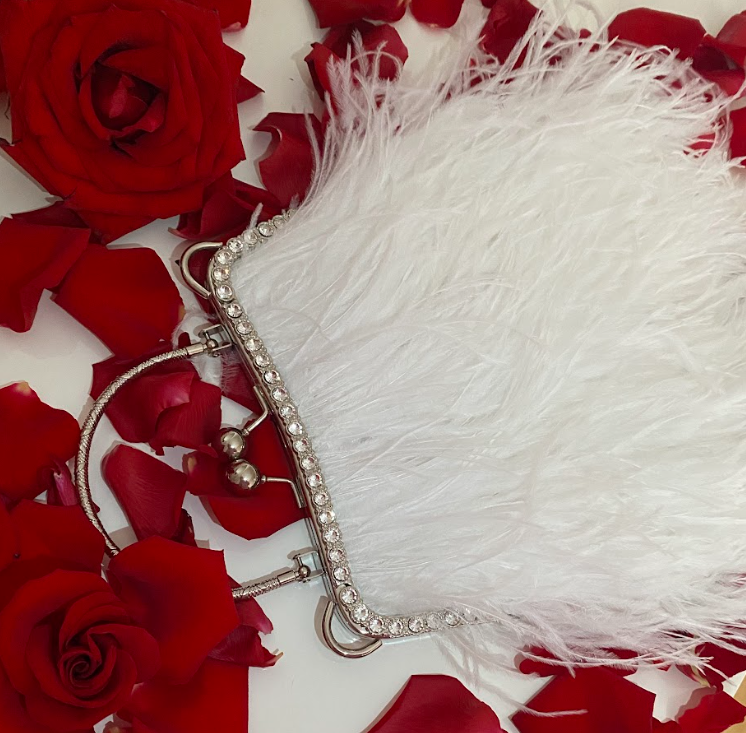 White bag with a crystal decorated handle