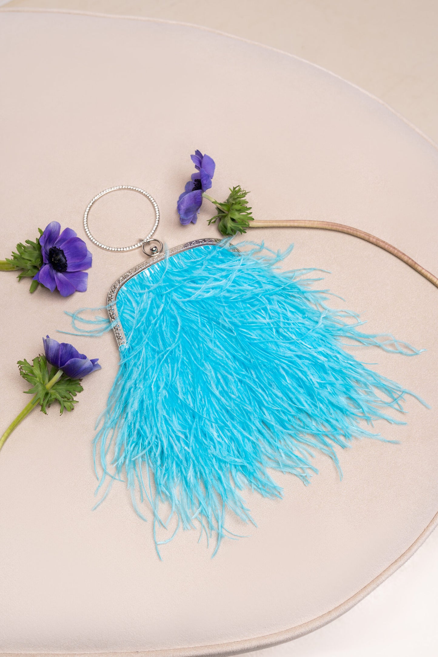 Bright blue bag with a crystal decorated handle