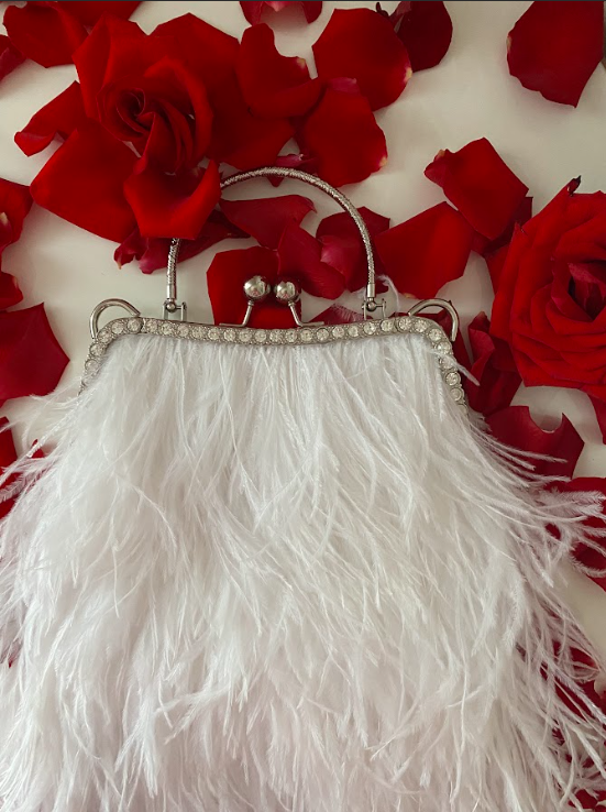 White bag with a crystal decorated handle