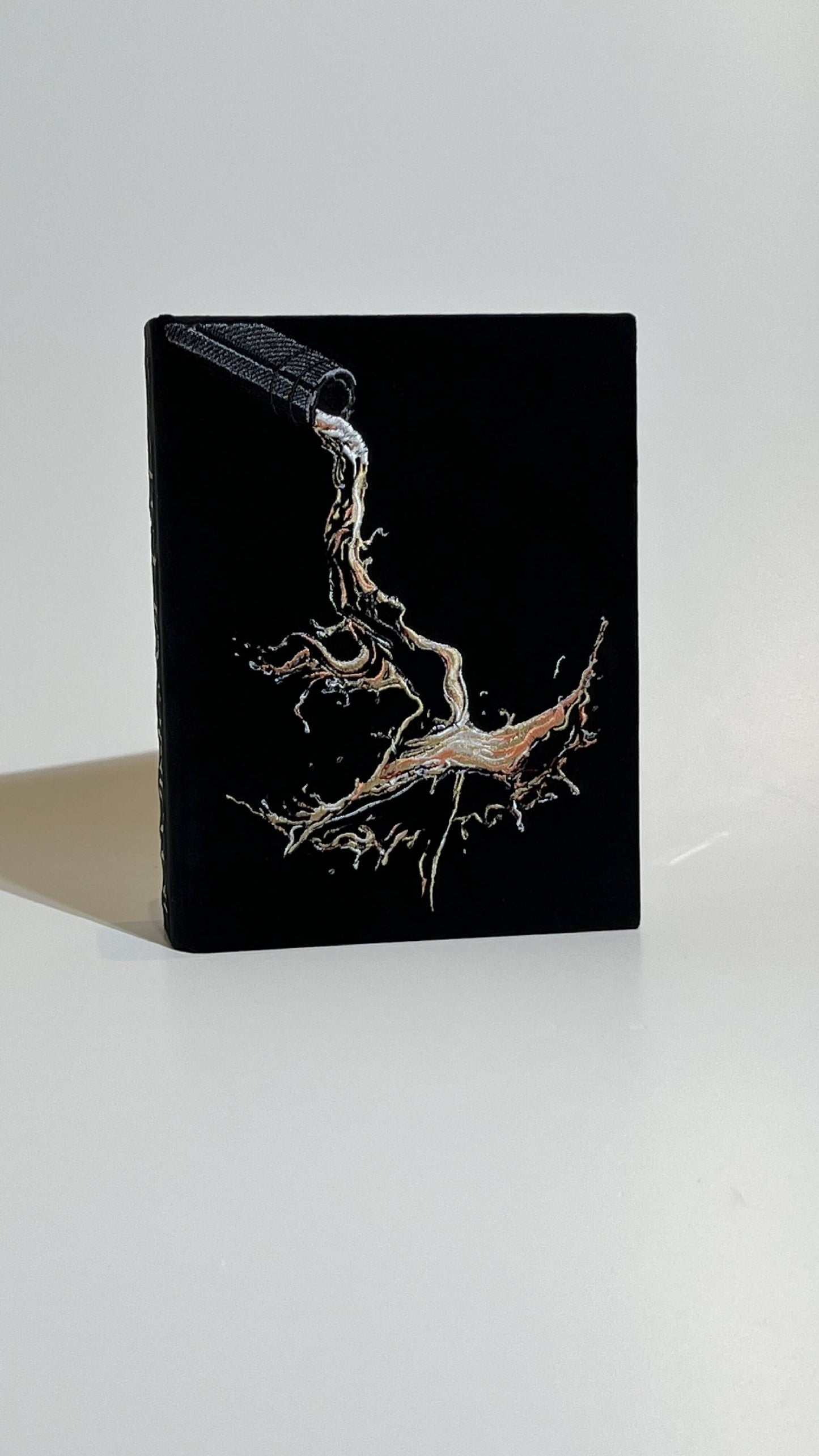 Embroidered clutch In vino veritas