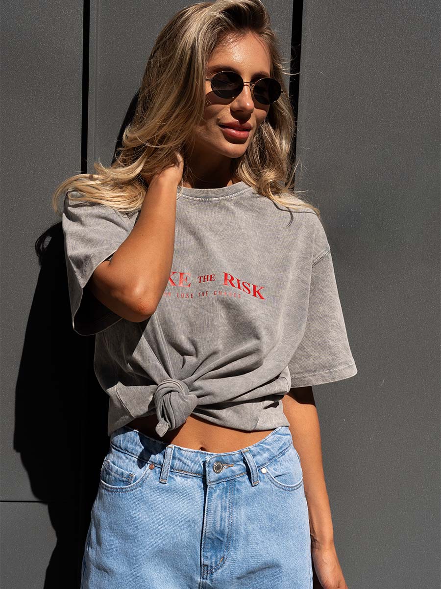 T-shirt cooked in light gray color with Take the risk print