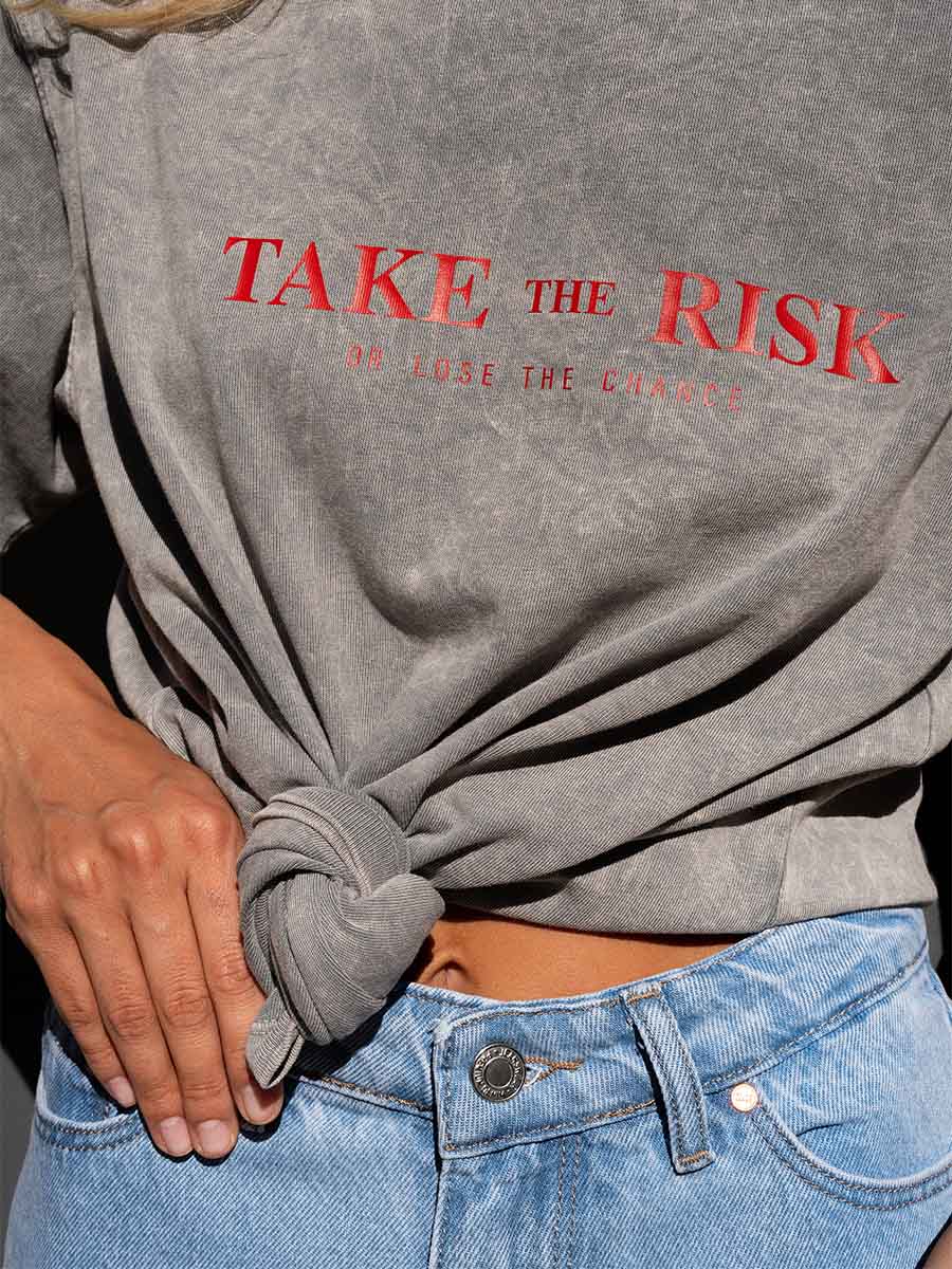 T-shirt cooked in light gray color with Take the risk print