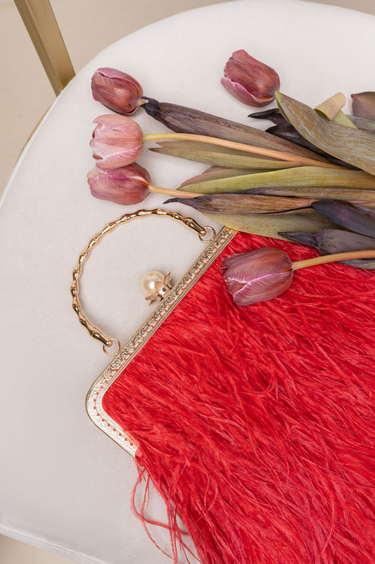 Red bag with a pearl decorated handle