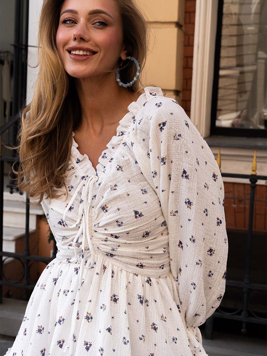 White muslin mini dress with flowery print