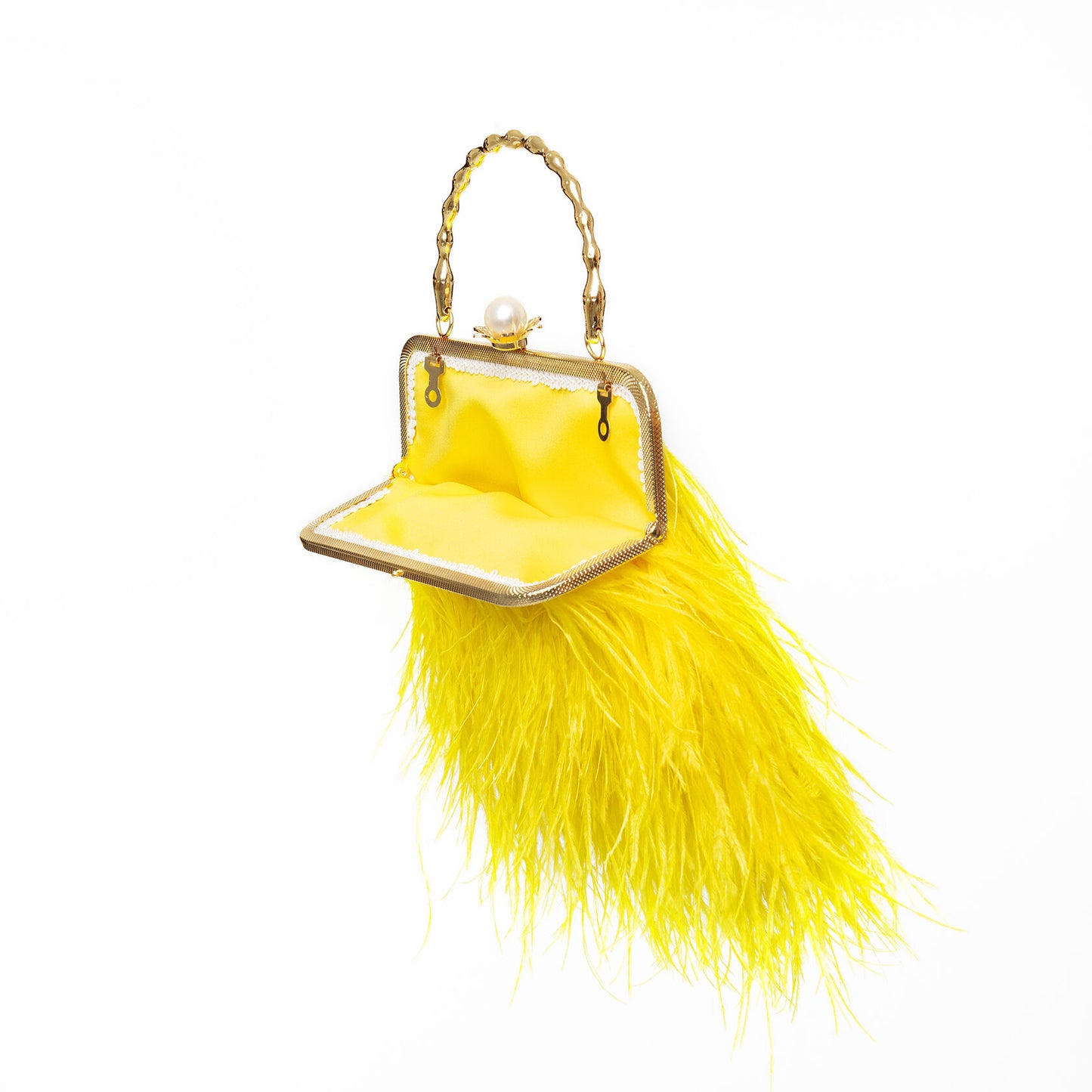 Yellow bag with a pearl decorated handle