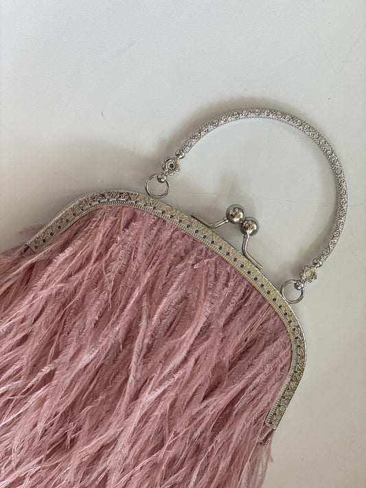 Powder bag with a flower decorated handle