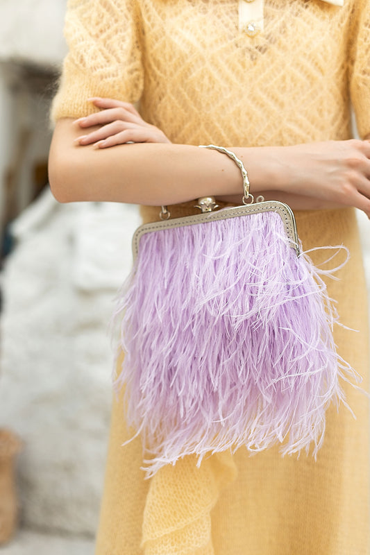Lilac bag with a pearl decorated handle