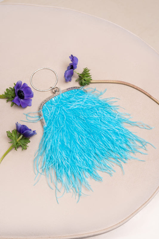 Bright blue bag with a crystal decorated handle