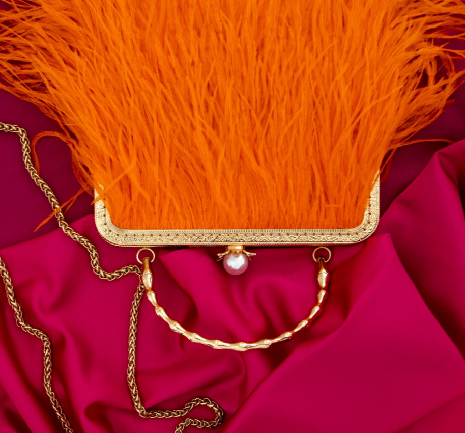 Orange bag with a pearl decorated handle