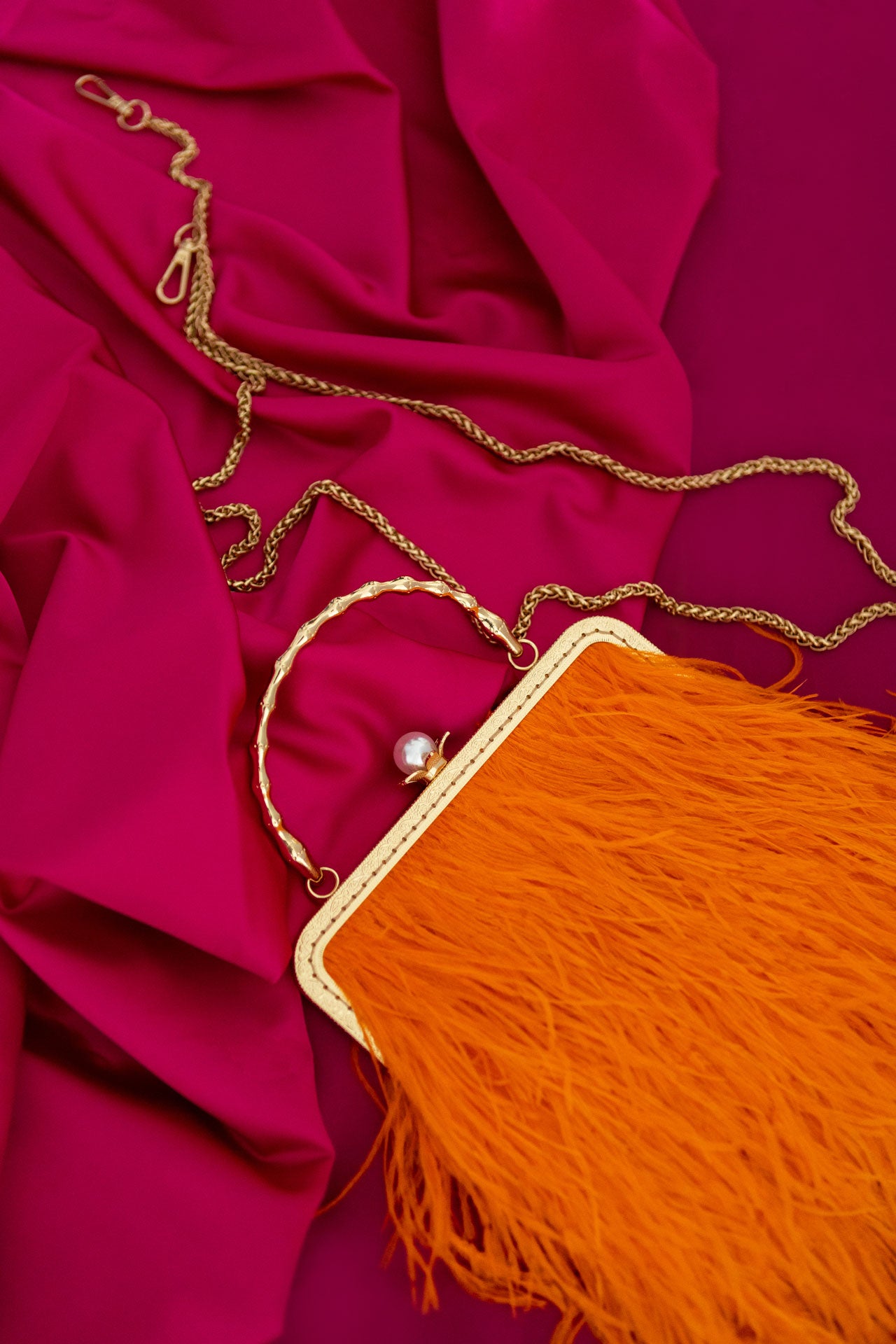 Orange bag with a pearl decorated handle