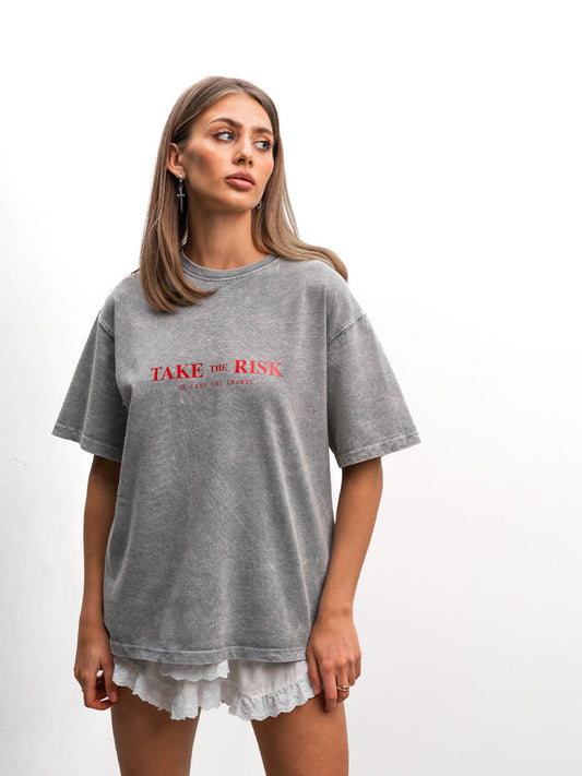 T-shirt cooked in light gray color with Take the risk print