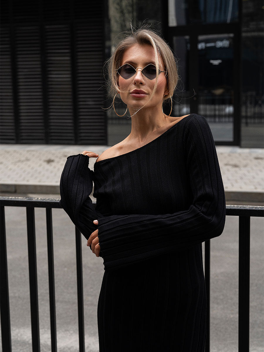 Black knitted midi dress with a cutout on the back
