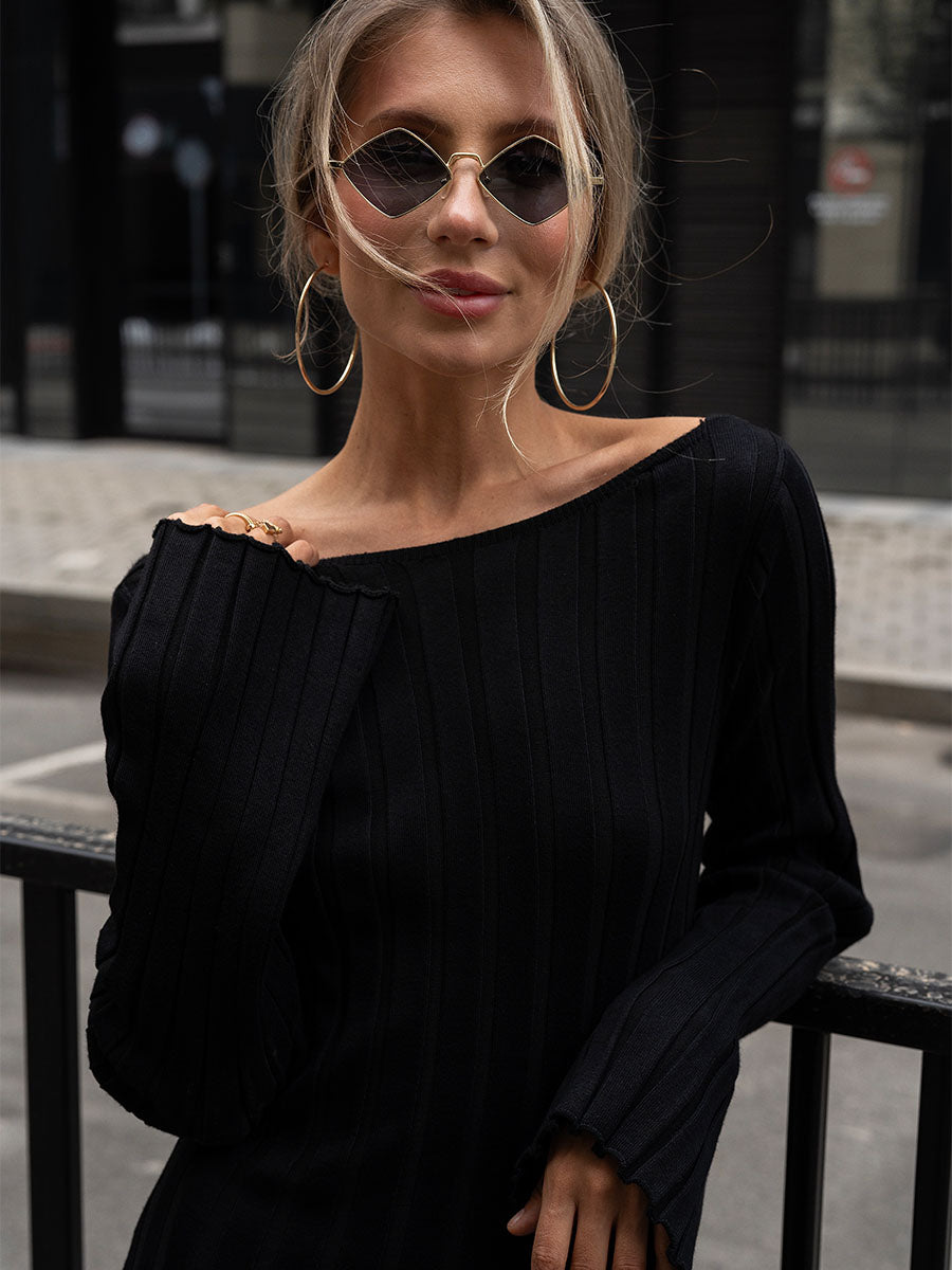 Black knitted midi dress with a cutout on the back