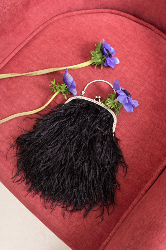 Black bag with a flowers decorated handle